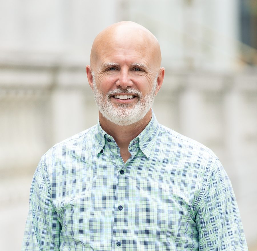 Close-up of Mark Machen smiling, outdoors